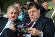 15 June 2008; An Taoiseach Brian Cowen and GAA President Nickey Brennan read the programme before the game. GAA Hurling Leinster Senior Championship Semi-Final, Offaly v Kilkenny, O'Moore Park, Portlaoise, Co. Laois. Picture credit: Ray McManus / SPORTSFILE