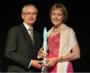 9 May 2015; Mary Doyle, from Limerick City, collects the Swim Ireland High Performance Athlete of the Year 2014 award on behalf of her daughter Fiona Doyle from John Treacy, Chief Executive of the Irish Sports Council, Swim Ireland 2015 Awards Night. Citywest Hotel, Dublin. Picture credit: Matt Browne / SPORTSFILE