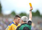 15 June 2008; Gordon Kelly, Clare, receives a yellow card from referee Paddy Russell. GAA Football Munster Senior Championship Semi-Final, Kerry v Clare, Fitzgerald Stadium, Killarney, Co. Kerry. Picture credit: Stephen McCarthy / SPORTSFILE
