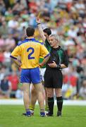 15 June 2008; Laurence Healy, Clare, receives a yellow card from referee Paddy Russell. GAA Football Munster Senior Championship Semi-Final, Kerry v Clare, Fitzgerald Stadium, Killarney, Co. Kerry. Picture credit: Stephen McCarthy / SPORTSFILE