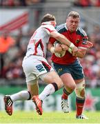 9 May 2015; Dave Kilcoyne, Munster, is tackled by Darren Cave, Ulster. Guinness PRO12, Round 21, Ulster v Munster. Kingspan Stadium, Ravenhill Park, Belfast. Picture credit: Ramsey Cardy / SPORTSFILE