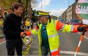 11 May 2015; Former Republic of Ireland International Kevin Kilbane surprises Sheriff YC legend Noel Kelligher, and lollipop man at St Laurence O'Toole's NS on Seville Place in the inner city, with VIP tickets to the FAI Junior Cup Final at the Aviva Stadium on Sunday during the FAI Junior Cup Tour and Community Day. Seville Place, Dublin. Picture credit: Piaras Ó Mídheach / SPORTSFILE