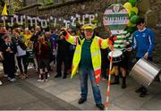 11 May 2015; Sheriff YC legend Noel Kelligher, and lollipop man at St Laurence O'Toole's NS on Seville Place in the inner city, celebrates after being surprised with VIP tickets to the FAI Junior Cup Final at the Aviva Stadium on Sunday by former Republic of Ireland International Kevin Kilbane during the FAI Junior Cup Tour and Community Day. Seville Place, Dublin. Picture credit: Piaras Ó Mídheach / SPORTSFILE
