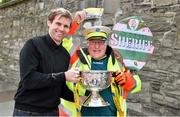 11 May 2015; Sheriff YC legend and lollipop man at St Laurence O'Toole's NS, Seville Place, Noel Kelleher celebrates after being surprised with VIP tickets to the FAI Junior Cup Final at the Aviva Stadium on Sunday by former Republic of Ireland International Kevin Kilbane during the FAI Junior Cup Tour and Community Day. Seville Place, Dublin. Picture credit: Cody Glenn / SPORTSFILE