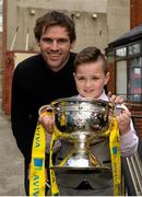 11 May 2015; Aaron Doherty, aged 8, from City Quay NS, Gloucester Street South, Dublin, met with former Republic of Ireland International Kevin Kilbane and the FAI Junior Cup during the FAI Junior Cup Tour and Community Day where two supporters were surprised with VIP tickets to the FAI Junior Cup Final at the Aviva Stadium on Sunday. Gloucester Street South, Dublin. Picture credit: Piaras Ó Mídheach / SPORTSFILE