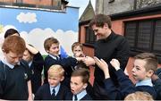 11 May 2015; Former Republic of Ireland International Kevin Kilbane signs autographs to students at City Quay N.S. on Gloucester Street South in Dublin 2 during the FAI Jnr Cup Tour and Community Day. Picture credit: Cody Glenn / SPORTSFILE