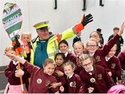 11 May 2015; Sheriff YC legend and lollipop man at St Laurence O'Toole's NS, Seville Place, Noel Kelleher, who was surprised with VIP tickets to the FAI Junior Cup Final at the Aviva Stadium on Sunday by former Republic of Ireland International Kevin Kilbane, not pictured, dances with students of St. Laurence O'Toole's during the FAI Junior Cup Tour and Community Day. Seville Place, Dublin. Picture credit: Cody Glenn / SPORTSFILE