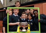 11 May 2015; Former Republic of Ireland International Kevin Kilbane poses for a photograph with children from City Quay NS, Gloucester Street South, Dublin, during the FAI Junior Cup Tour and Community Day where two supporters were surprised with VIP tickets to the FAI Junior Cup Final at the Aviva Stadium on Sunday. City Quay NS, Gloucester Street South, Dublin. Picture credit: Piaras Ó Mídheach / SPORTSFILE