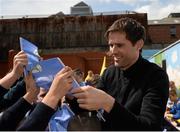 11 May 2015; Former Republic of Ireland International Kevin Kilbane signs autographs for children in City Quay NS, Gloucester Street South, Dublin, during the FAI Junior Cup Tour and Community Day where two supporters were surprised with VIP tickets to the FAI Junior Cup Final at the Aviva Stadium on Sunday. Gloucester Street South, Dublin. Picture credit: Piaras Ó Mídheach / SPORTSFILE