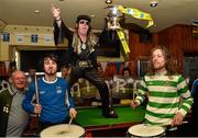 11 May 2015; Michael 'Elvis' Heapes of Ringsend dances to the sounds of Hit Machine Drummers Michael Flemming, left, and Daniel Lang on the pool table at The Padraig Pearse pub during a stop on the FAI Jnr Cup Tour and Community Day. The Padraig Pearse pub, Pearse Street, Dublin. Picture credit: Cody Glenn / SPORTSFILE