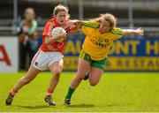 9 May 2015; Fionnuala McKenna, Armagh, in action against Kate Keeney, Donegal. TESCO HomeGrown Ladies National Football League, Division 2 Final, Armagh v Donegal. Parnell Park, Dublin. Picture credit: Piaras Ó Mídheach / SPORTSFILE