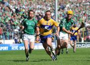 22 June 2008; Colin Lynch, Clare, with Limerick players Ollie Moran and Donie Ryan in persuit. GAA Hurling Munster Senior Championship Semi-Final, Limerick v Clare, Semple Stadium, Thurles, Co. Tipperary. Picture credit: Ray McManus / SPORTSFILE