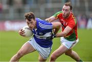 16 May 2015; John O'Loughlin, Laois, in action against David Bambrick, Carlow. Leinster GAA Football Senior Championship, Round 1, Carlow v Laois, Netwatch Cullen Park, Carlow. Picture credit: Matt Browne / SPORTSFILE