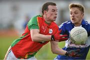 16 May 2015; Barry John Molloy, Carlow, in action against Ross Munnelly, Laois. Leinster GAA Football Senior Championship, Round 1, Carlow v Laois, Netwatch Cullen Park, Carlow. Picture credit: Matt Browne / SPORTSFILE