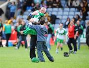 22 June 2008; Catherine McKeefry, Michael Davitt's, Co. Derry, celebrates with her father Liam and brother Ciaran at the final whistle. Feile na nGael Camogie Finals - Division 2 Final, Michael Davitt's, Co.Derry v Lismore, Co. Waterford, O'Moore Park, Portlaoise, Laois. Picture credit: Matt Browne / SPORTSFILE