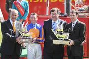 29 June 2008; Taoiseach, Mr. Brian Cowen TD, second from right, presents the winning trainer Aidan O'Brien with his trophy and Colm McLoughlin, Managing Director of Dubai Duty Free, presents the winning jockey Seamie Heffernan with his trophy after Frozen Fire won the Dubai Duty Free Irish Derby, Curragh Racecourse, Co. Kildare. Picture credit: Matt Browne / SPORTSFILE