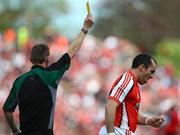 29 June 2008; Martin O'Rourke, Armagh, receives a yellow card from Referee Joe McQuillan. GAA Football Ulster Senior Championship Semi-Final, Down v Armagh, St Tighearnach's Park, Clones, Co. Monaghan. Picture credit: Oliver McVeigh / SPORTSFILE