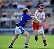 29 June 2008; Kevin Mossey, Tyrone, in action against Kevin Meehan, Cavan. ESB Ulster Minor Football Championship semi-final, Cavan v Tyrone, St Tighearnach's Park, Clones, Co. Monaghan. Picture credit: David Maher / SPORTSFILE