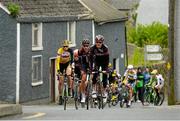17 May 2015; The leading pack make their way through Hacketstown, Co. Carlow, during Stage 1 of the 2015 An Post Rás. Dunboyne - Carlow. Photo by Sportsfile