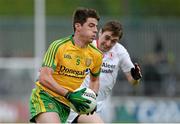 17 May 2015; Daire O'Baoill, Donegal, in action against Michael Corless, Tyrone. Electric Ireland Ulster GAA Football Minor Championship, 1st Round, Donegal v Tyrone. MacCumhaill Park, Ballybofey, Co. Donegal. Picture credit: Oliver McVeigh / SPORTSFILE