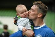 17 May 2015; Crumlin United captain James Lee celebrates with his 8 month old son Josh at the end of the game. FAI Umbro Intermediate Cup Final, Tolka Rovers v Crumlin United. Aviva Stadium, Lansdowne Road, Dublin. Picture credit: David Maher / SPORTSFILE