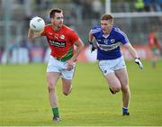 16 May 2015; Ed Finnegan, Carlow, in action against Evan Carroll, Laois. Leinster GAA Football Senior Championship, Round 1, Carlow v Laois, Netwatch Cullen Park, Carlow. Picture credit: Matt Browne / SPORTSFILE