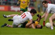 17 May 2015; Christy Toye, Donegal, is tackled by Colm Cavanagh, right, and Mattie Donnelly, Tyrone. Ulster GAA Football Senior Championship, Preliminary Round, Donegal v Tyrone. MacCumhaill Park, Ballybofey, Co. Donegal. Picture credit: Oliver McVeigh / SPORTSFILE
