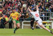17 May 2015; Ronan McNabb, Tyrone, attempts to block down a kick from Frank McGlynn, Donegal. Ulster GAA Football Senior Championship, Preliminary Round, Donegal v Tyrone. MacCumhaill Park, Ballybofey, Co. Donegal. Picture credit: Oliver McVeigh / SPORTSFILE