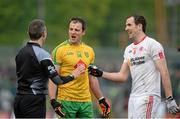 17 May 2015; Michael Murphy, Donegal, speaks to Maurice Deegan, standby Referee, about a second half incident as Justin McMahon, Tyrone, watches. Ulster GAA Football Senior Championship, Preliminary Round, Donegal v Tyrone. MacCumhaill Park, Ballybofey, Co. Donegal. Picture credit: Oliver McVeigh / SPORTSFILE
