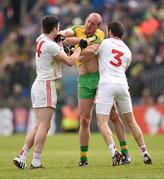 17 May 2015; Neil Gallagher, Donegal, and Sean Cavanagh, left, and Ronan McNamee, right, Tyrone, tussle off the ball. Ulster GAA Football Senior Championship, Preliminary Round, Donegal v Tyrone. MacCumhaill Park, Ballybofey, Co. Donegal. Picture credit: Stephen McCarthy / SPORTSFILE