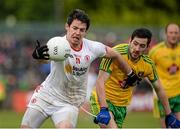 17 May 2015; Mattie Donnelly, Tyrone, in action against Mark McHugh, Donegal. Ulster GAA Football Senior Championship, Preliminary Round, Donegal v Tyrone. MacCumhaill Park, Ballybofey, Co. Donegal. Picture credit: Oliver McVeigh / SPORTSFILE