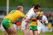 17 May 2015; Colm Cavanagh, Tyrone, in action against Neil McGee, Donegal. Ulster GAA Football Senior Championship, Preliminary Round, Donegal v Tyrone. MacCumhaill Park, Ballybofey, Co. Donegal. Picture credit: Oliver McVeigh / SPORTSFILE