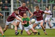 17 May 2015; Fergal Clancy, Leitrim, tries to release the ball under pressure from Galway's Damien Comer, Cathal Sweeney and Gary O'Donnell. Connacht GAA Football Senior Championship Quarter-Final, Leitrim v Galway. Parc Sean Mac Diarmada. Picture credit: Ray Ryan / SPORTSFILE