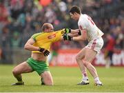 17 May 2015; Neil Gallagher, Donegal, and Sean Cavanagh, Tyrone, tussle off the ball. Ulster GAA Football Senior Championship, Preliminary Round, Donegal v Tyrone. MacCumhaill Park, Ballybofey, Co. Donegal. Picture credit: Stephen McCarthy / SPORTSFILE