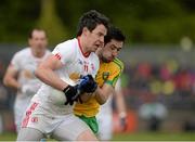 17 May 2015; Mattie Donnelly, Tyrone, in action against Mark McHugh, Donegal. Ulster GAA Football Senior Championship, Preliminary Round, Donegal v Tyrone. MacCumhaill Park, Ballybofey, Co. Donegal. Picture credit: Oliver McVeigh / SPORTSFILE