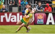17 May 2015; Sean Cavanagh, Tyrone, tackles Paddy McGrath, Donegal, for which he received a black card and a subsequent red card. Ulster GAA Football Senior Championship, Preliminary Round, Donegal v Tyrone. MacCumhaill Park, Ballybofey, Co. Donegal. Picture credit: Stephen McCarthy / SPORTSFILE