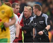 17 May 2015; Tyrone selector Gavin Devlin speaks with referee Joe McQuillan at half time. Ulster GAA Football Senior Championship, Preliminary Round, Donegal v Tyrone. MacCumhaill Park, Ballybofey, Co. Donegal. Picture credit: Stephen McCarthy / SPORTSFILE