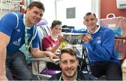 18 May 2015; Liffey Wanderers players, from left to right, Anthony O'Connor, Paul Gannon and Gary Young with Joseph Fitzachary, age11, from Kilsallaghan, Co. Dublin, and the FAI Junior Cup trophy during a visit to Temple Street Hospital, Temple Street Hospital, Dublin. Picture credit: Cody Glenn / SPORTSFILE