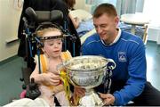 18 May 2015; Liffey Wanderers' Gary Young with Grace Cogan, age 7, from Monaghan, and the FAI Junior Cup trophy during a visit to Temple Street Hospital, Temple Street Hospital, Dublin. Picture credit: Cody Glenn / SPORTSFILE