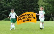 26 June 2008; Get Booking: Jordan Duffy and Chelsey Colmey, both from Corduff, remind parents that its advanced bookings only for the FAI National Irish Bank Summer Soccer programme. Football Association of Ireland, National Sports Campus, Abbotstown, Dublin. Picture credit: Matt Browne / SPORTSFILE