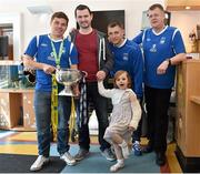18 May 2015; Liffey Wanderers players Anthony O'Connor, left, and Gary Young, second from right, with manager John Young and former Liffey Wanderers team-mate Derek Brady, second from left, and his daughter Ella, age 4, originally from Pearse Street, Dublin, who were visiting the hospital for an X-ray on Ella's broken arm, with the FAI Junior Cup trophy during a visit to Temple Street Hospital, Temple Street Hospital, Dublin. Picture credit: Cody Glenn / SPORTSFILE