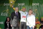 18 May 2015; Jaap de Man, Team 3M, after receiving the The Irish Sports Council U23 White Jersey Classification from Martin Quinn, vice-chairman South Tipperary Sports Partnership, and Miss An Post Rás Tracy Byrne, following Stage 2 of the 2015 An Post Rás. Carlow - Tipperary. Photo by Sportsfile