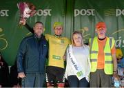 18 May 2015; Lukas Postlberger, Tirol Cycling Team, after receiving the An Post Rás Yellow Jersey Classification from local Tipperary postman Tom Cunningham, left, Miss An Post Rás Tracy Byrne, and Stage Finish Organiser Pat Barragry, following Stage 2 of the 2015 An Post Rás. Carlow - Tipperary. Photo by Sportsfile