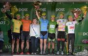 18 May 2015; Miss An Post Rás Tracy Byrne with, from left, An Post Rás Yellow Jersey Classification winner Lukas Postlberger, Tirol Cycling Team, LeasePlan Stage Jersey winner Alex Frame, New Zealand National Team, One Direct County Jersey winner Ian Richardson, UCD, The Post Office Sprint Jersey Classification winner Aaron Gate, An Post Chain Reaction, One4All Bikes4Work King of the Mountains Jersey Classification winner Robert Patrick, NFTO NPC, and The Irish Sports Council U23 White Jersey Classification winner Jaap de Man, Team 3M. Stage 2 of the 2015 An Post Rás. Carlow - Tipperary. Photo by Sportsfile
