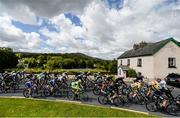 19 May 2015; A view of the peloton as it makes its way through Broadford, Co. Limerick, during Stage 3 of the 2015 An Post Rás. Tipperary - Bearna. Photo by Sportsfile