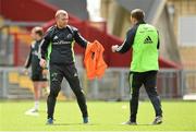19 May 2015; Munster's Keith Earls hands his bib to Andrew Conway during squad training. Thomond Park, Limerick. Picture credit: Diarmuid Greene / SPORTSFILE