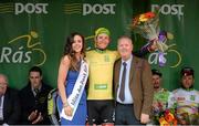 19 May 2015; Lukas Postlberger, Tirol Cycling Team, after receiving the An Post Rás Yellow Jersey Classification from Tommy Hehir, Delivery Services manager An Post and Miss An Post Rás Aisling Feeney following Stage 3 of the 2015 An Post Rás. Tipperary - Bearna. Photo by Sportsfile