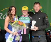 19 May 2015; Peter Hawkins, Down North, after receiving the Cuchulainn statue for the first county rider home in Stage 3 from stage end organiser Nigel Forde and Miss An Post Rás Aisling Feeney following Stage 3 of the 2015 An Post Rás. Tipperary - Bearna. Photo by Sportsfile