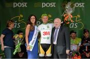 19 May 2015; Jaap de Man, Team 3M, after receiving the The Irish Sports Council U23 White Jersey Classification from Cllr. Declan McDonnell, Chairperson Galway Sports Partnership, and Miss An Post Rás Aisling Feeney following Stage 3 of the 2015 An Post Rás. Tipperary - Bearna. Photo by Sportsfile