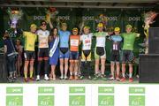 19 May 2015; Miss An Post Rás Aisling Feeney with, from left, An Post Rás Yellow Jersey Classification winner Lukas Postlberger, Tirol Cycling Team, One4All Bikes4Work King of the Mountains Jersey Classification winner Robert Partridge, NFTO NPC, One Direct County Jersey winner Ian Richardson, UCD,  LeasePlan Stage Jersey winner Matteo Malucelli, Team IDEA 2010 ASD, 3rd across the line Andreas Hofer, Hrinkow Advarics, first county rider home Peter Hawkins, Down North, and Post Office Sprint Jersey Classification winner Alex Frame, New Zealand National Team, following Stage 3 of the 2015 An Post Rás. Tipperary - Bearna. Photo by Sportsfile